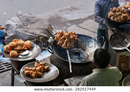 VARANASI, INDIA - DEC 23, 2014: Indian street food in the street market. Varanasi. Uttar Pradesh. India