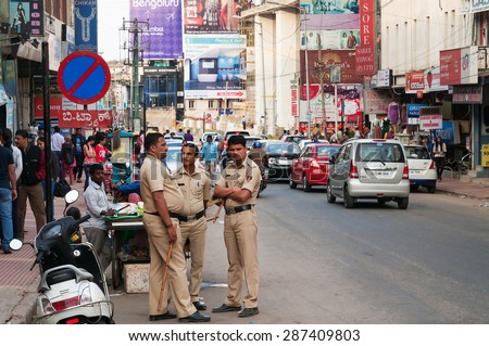BANGALORE, INDIA - DEC 25, 2014: Policemen on Commercial street. Commercial street in Bangalore is one of the main shopping complexes in India