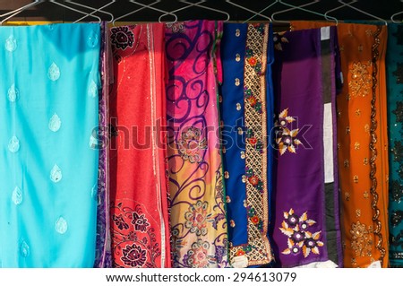 AGRA, INDIA - DEC 17, 2014: Colorful different sari on street market in Agra. Sari is the traditional women\'s clothing for India