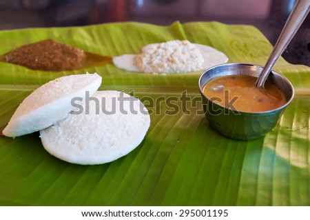 Indian breakfast Idli on palm leaf. Traditional South Indian breakfast