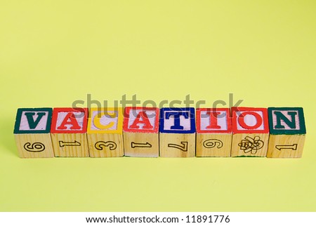 The word vacation spelled out using baby blocks