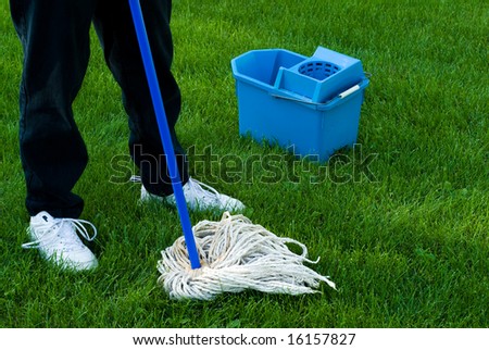 Somebody using a mop and pail to clean up the Earth