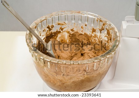 A bowl of freshly mixed chocolate cookie batter