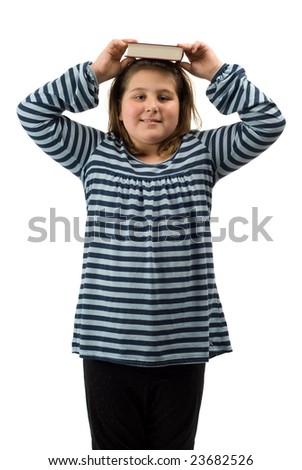 A young girl balancing school work on her head, isolated against a white background
