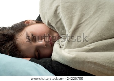 Closeup view of a young girl covered with a blanket and sleeping