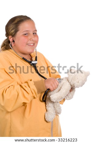 stock photo A young preteen playing with a stethoscope and checking the