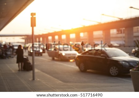 Blurred image of cars waiting in LAX Los Angeles international airport arrivals terminal taxi lane, an uber pick up location.