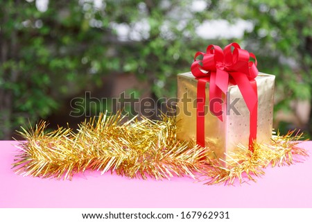 Christmas gift box  in nature background