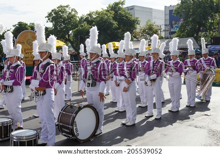 NAKHON RATCHASIMA, THAILAND - JULY 12 : Unidentified marching band participate parade of opening traditional candle procession festival of Buddha, on July 12, 2014 in Nakhon Ratchasima, Thailand.
