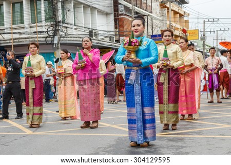 NAKHON RATCHASIMA, THAILAND - JULY 31: Thai people participate parade in grand of opening the traditional candle procession festival of Buddha, on July 31, 2015 in Nakhon Ratchasima, Thailand.