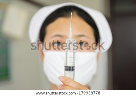 LUANNAN, CHINA-On November 18, Nurses are pushing syringes, luanhe river east hospital in nanjing, on November 18, 2013 to the south of the luanhe river, tangshan city, hebei province, China