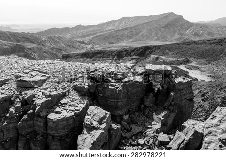 Black and white desert mountains cliffs. Rock canyons, Shhoret mountain, Negev desert, Israel.