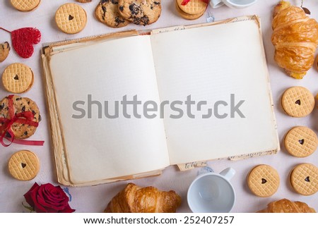 Valentines day background. Valentines day breakfast. Blank book with cookies and roses on white wooden table