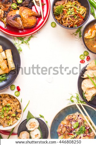 Chinese food white background. Chinese noodles, fried rice, dumplings, peking duck, dim sum, spring rolls. Famous Chinese cuisine dishes set. Space for text. Top view. Chinese restaurant concept