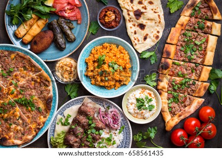 Traditional assorted turkish dishes. Turkish pizza, meat kebab, pita, bulgur, fried meatballs, hummus and turkish meze set. Middle eastern dinner. Food party. Turkish cuisine. Top view. Eastern food