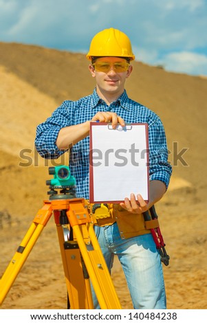 a worker holding empty clipboard