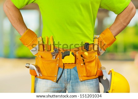 tools in belt of worker