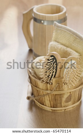 bucket and mug on wooden background