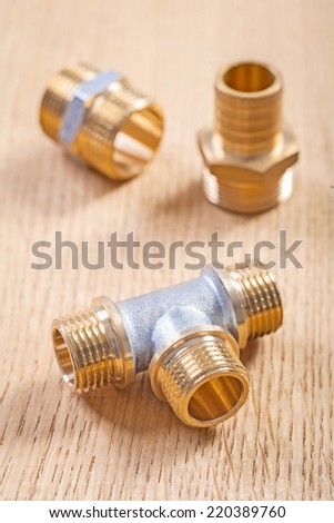 plumbing fixtures on wooden board