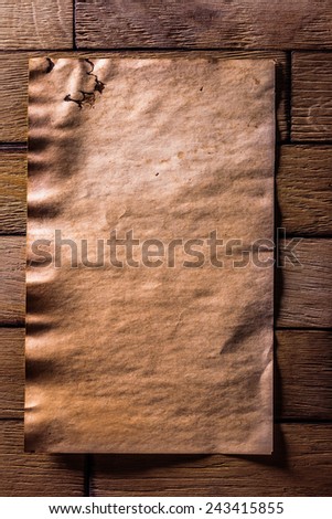 vintage brown paper on old wooden boards