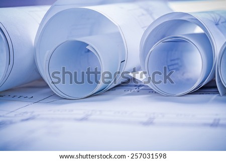 rolls of blueprints very close up view horizontal view