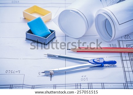 composition rolls of blueprints eraser compass pencil
