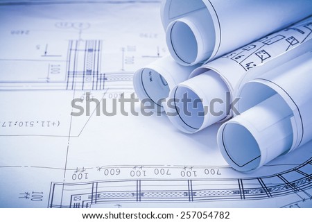close up view stack of white construction blueprints with copyspace for your text
