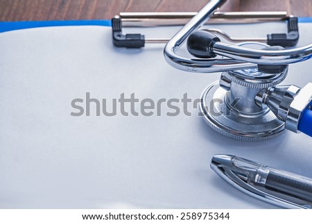 medical stethoscope ballpoint pen on paper in clipboard medical comcept