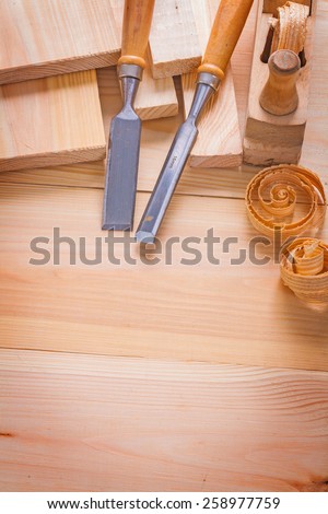 copyspace image composition of woodworking tools carpentry chisels and plane on wooden boards construction concept