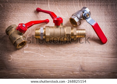 Plumbing Tools Composition Of Brass Pipe Connectors On Wooden Board