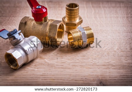 View Plumbing Tools Brass Pipe Connectors On Wooden Board Close Up