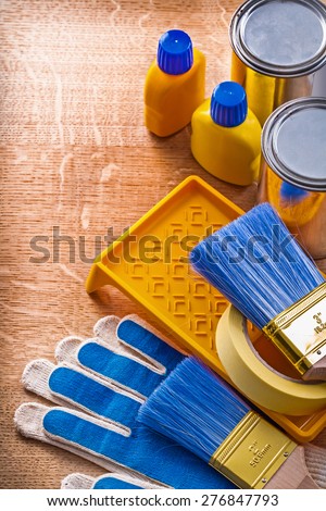 Wooden board with group of house improvement paint tools construction concept