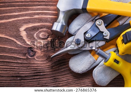 Group of house improvement tools on vintage wood board construction concept