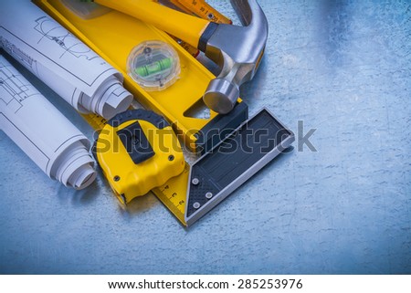 Stack of repairing working tools on industrial metallic background construction concept.