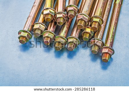 Variation of anchor bolts for concrete walls and nuts on metallic background repairing concept