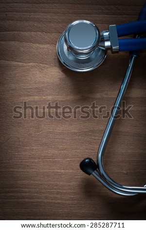 Diagnostic device for medical check up on pine vintage wooden board medicine concept