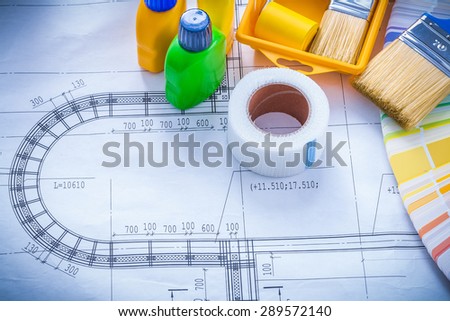 Construction drawing with paint brush roller tray bottles duct tape and color sampler maintenance concept.