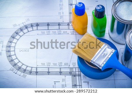 Blueprint with paint brush metal cans plastic bottles and adhesive household tape maintenance concept.