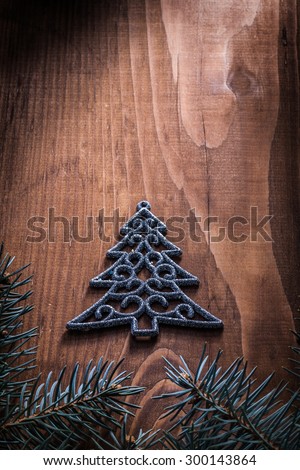 simbol toy of fir tree and branches on wood board.