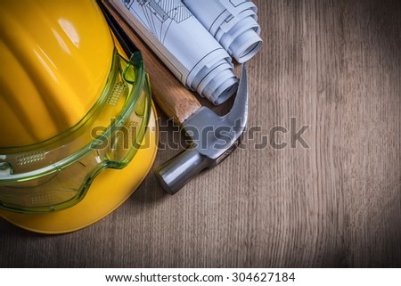 Claw hammer safety glasses construction drawings and protective cap.