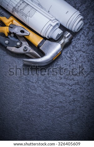 Construction drawings tin snips pliers claw hammer on black background.