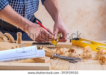 Man with carpenters tools construction concept.