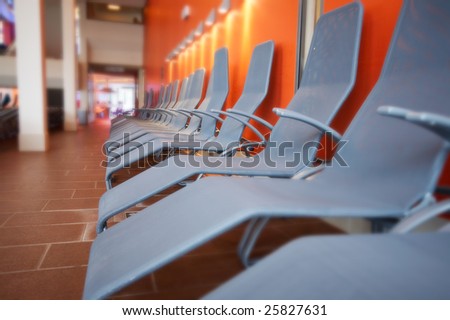 the row of grey chairs in the gym