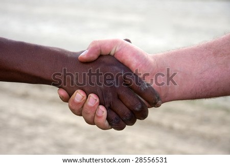 black and white hands shaking. a hand shake,interracial