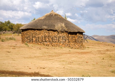traditional african hut stone and thatch in Lesotho