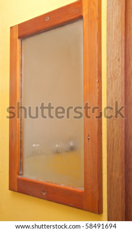 fogged up bathroom mirror rectangular wooden frame yellow wall