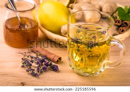 Still life with tea. Natural herbal tea with honey and lemon. Thymus serpillum.