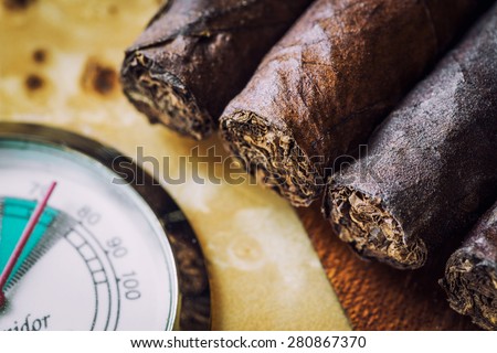 close-up quality cigar and humidor with hygrometer