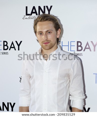 LOS ANGELES/CALIFORNIA - AUGUST 4, 2014: Actor Eric Nelson walks the red carpet at \