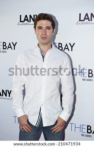 LOS ANGELES/CALIFORNIA - AUGUST 4, 2014: Actor Kristos Andrews walks the red carpet at \